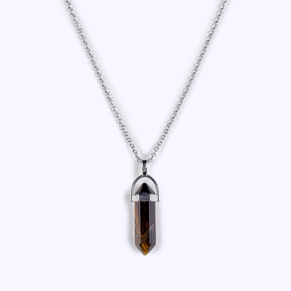 Front view studio product photograph of the single-terminated tiger's eye geometric point necklace centered on a clean white background, showcasing its distinct chatoyant light band and sharp crystal edges.